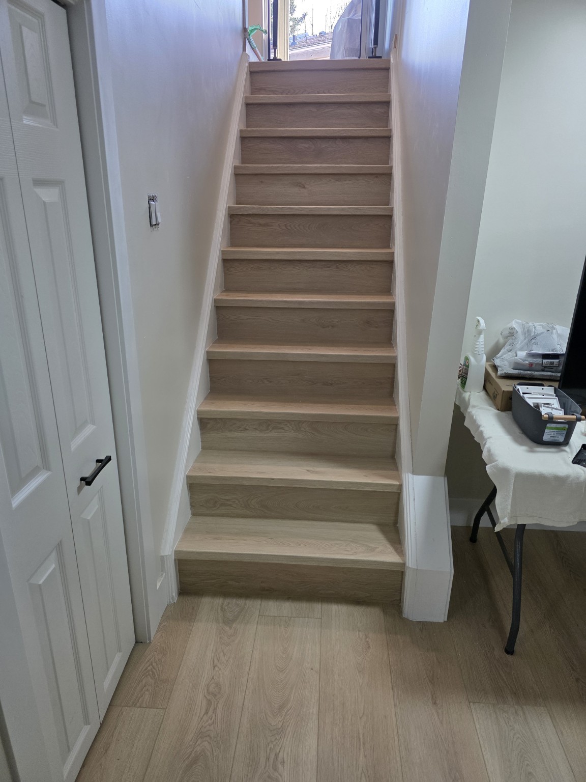Custom staircase finished using matching customer flooring